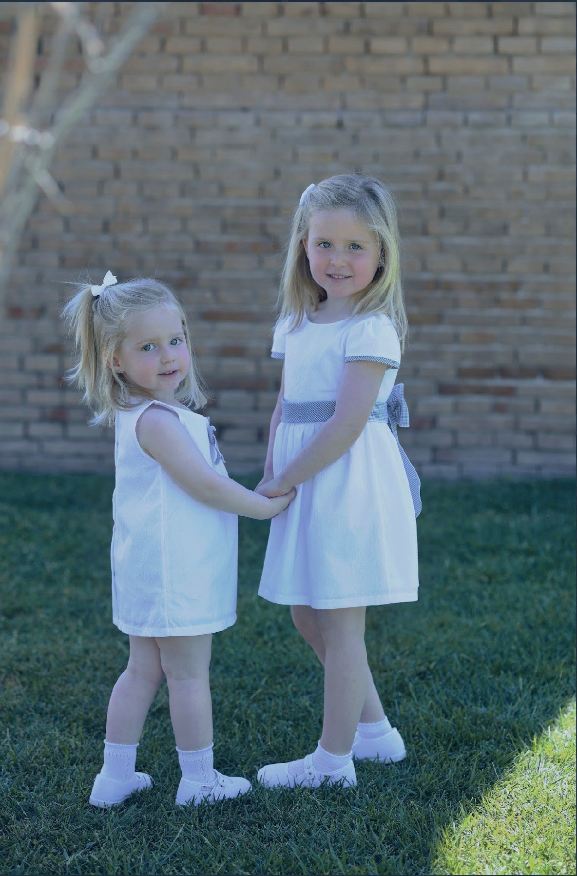 RAPIFE GIRLS WHITE DRESS WITH NAVY GINGHAM BOW DETAIL 5115C26
